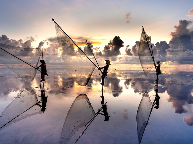 pescatore sui trampoli